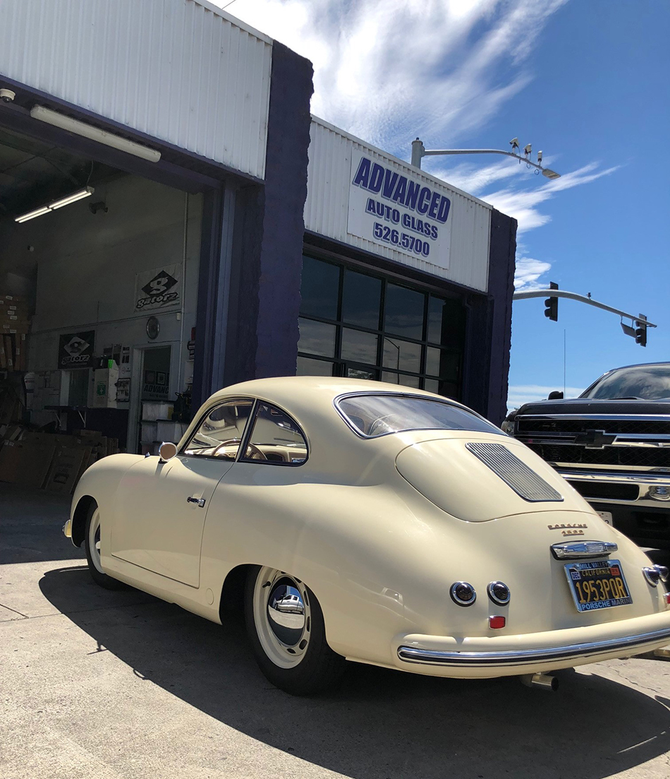 Vintage car in front of Advanced Auto Glass Shop